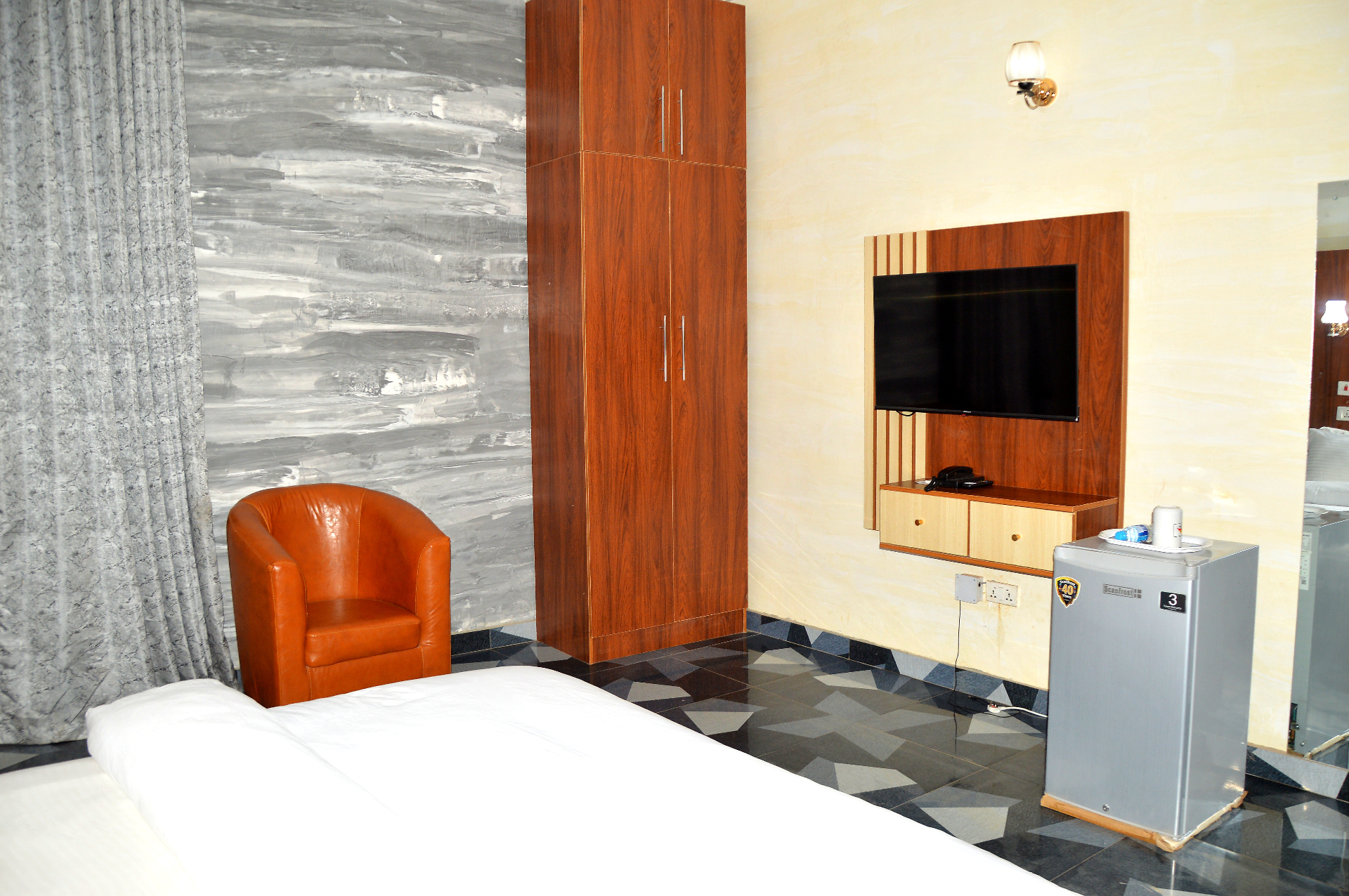 Deluxe bedroom with wardrobe and TV