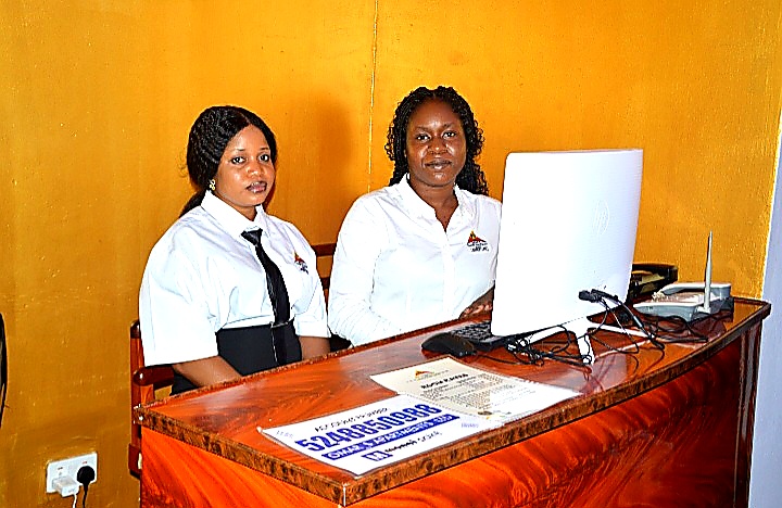 Front desk staff welcoming guests